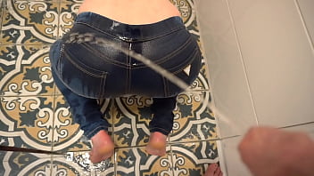 Homemade fetish video featuring desperate pissing in jeans and on ass