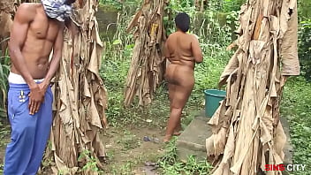 Neighborhood lady enjoys bathing in the open by the community well, incredibly attractive